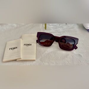 BRAND NEW fendi sunglasses in a deep purple. No fendi case, comes with paperwork